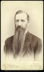 Historic bust portrait of a man with a beard.
