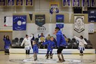 Traditional dancers perform in a school gym.