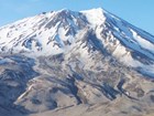 photo of a snow covered volcanic peak