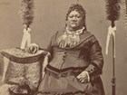 An old image of Princess Luka Ruth Ke?elikolani sitting down and posing for the camera.