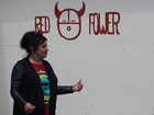 Dr. Warjack standing next to a spray painted building with the words Red Power