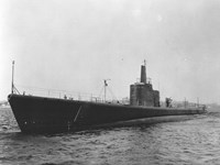 large dark ship above water (black and white photo)