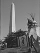Tipi and flag that reads 