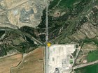 Aerial view of the Shoshone River with a star marking the monitoring site at the Highway 37 bridge.