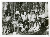Black and White photo of a large group of men standing in three rows