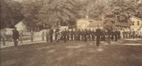 Black and white photo of African American army cadets in uniform standing in formation.