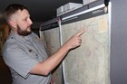 A park planner points to a map of Valles Caldera.