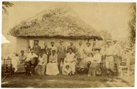 Black and white photo of group of African Americans standing in two rows shoulder to shoulder