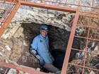 a person standing in a cave entrance