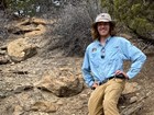 a person standing on a rock outcrop