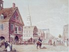 man riding horse on street past market stalls
