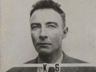Robert Oppenheimer poses unsmiling in security badge photo. “K6” is in text in front of his necktie.