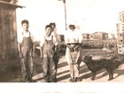 Tad and Saylo in work overalls with Masako, Namio, and Sam Munemitsu on the Westminster farm.