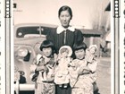 Black and white photo of a Japanese American woman and her two twin daughters