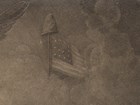 An early United States flag with a liberty cap atop the staff encircled by clouds.