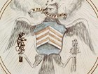 Sketch of an eagle holding an olive branch in one talon and arrows in the other.