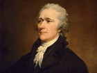 Portrait of Alexander Hamilton facing front-left wearing a black coat.