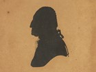 Silhouette of profile of George Washington from shoulders up.