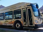 Photo of a bus with zion park name and fossil mural.