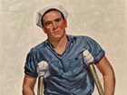 A sailor on crutches missing a leg stares out at the viewer with a building & park in the background