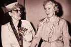 Photo of one woman congratulating another woman