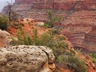 Photo of a redwalled canyon with layered rock.