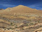 Photo of hillslope with exposed rock layers.