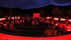 The new astronomy amphitheater bathed in red light to help with night sky viewing.