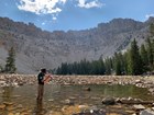 Staff member taking depth measurements of Baker Lake