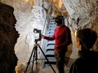 Two contractors using LiDAR to take images to create a virtual tour of Lehman Caves