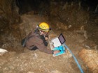 Staff member downloading data loggers in Lehman Caves