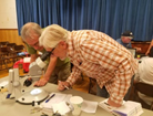 Two bioblitz participants looking in a microscope