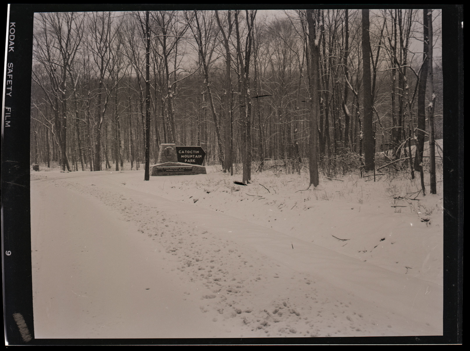 The sign and entrance to Catoctin Mountain Park after a snowfall.