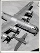 Black and white overhead photo of a plane with 2 propellers on each wing
