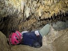 caver looking up at delicate formations