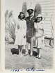 Black and white photo of man in military uniform with wife and mother 