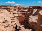 Photo of layered rocks in a desert canyon.
