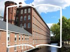 The Boott Mills and an outline of an open book