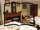 A boardinghouse dining room with an outline of an open book