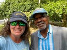A man and a woman smile for a selfie.