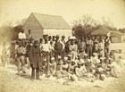 A group of people sit on a pile of cotton.