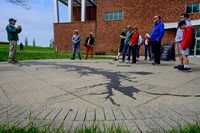 VIP Lou giving a program to visitors outback of the Fort McHenry Visitor Center