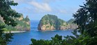 Scenic view of steep sided rock formations in the tropical ocean