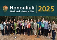 Honouliuli 10th Anniversary Celebration photo with group picture of people on a cement slab.