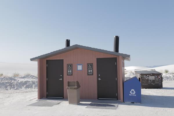 The Backcountry Camping Loop Trail restroom with its recycling and trash receptacles.