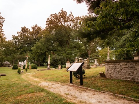 A modern photograph of a cemetery with a slight sepia tone