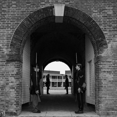 Living history volunteers standing sentry in Civil War uniform at sally port