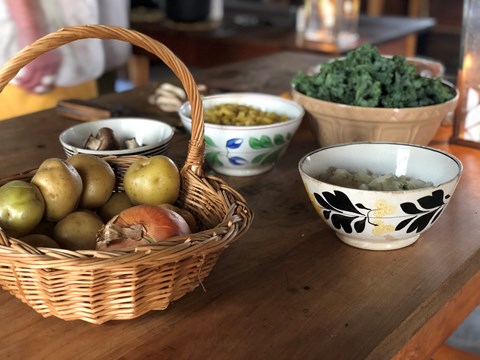 Ingredients in bowls sitting on a table in the Fort Vancouver Kitchen.