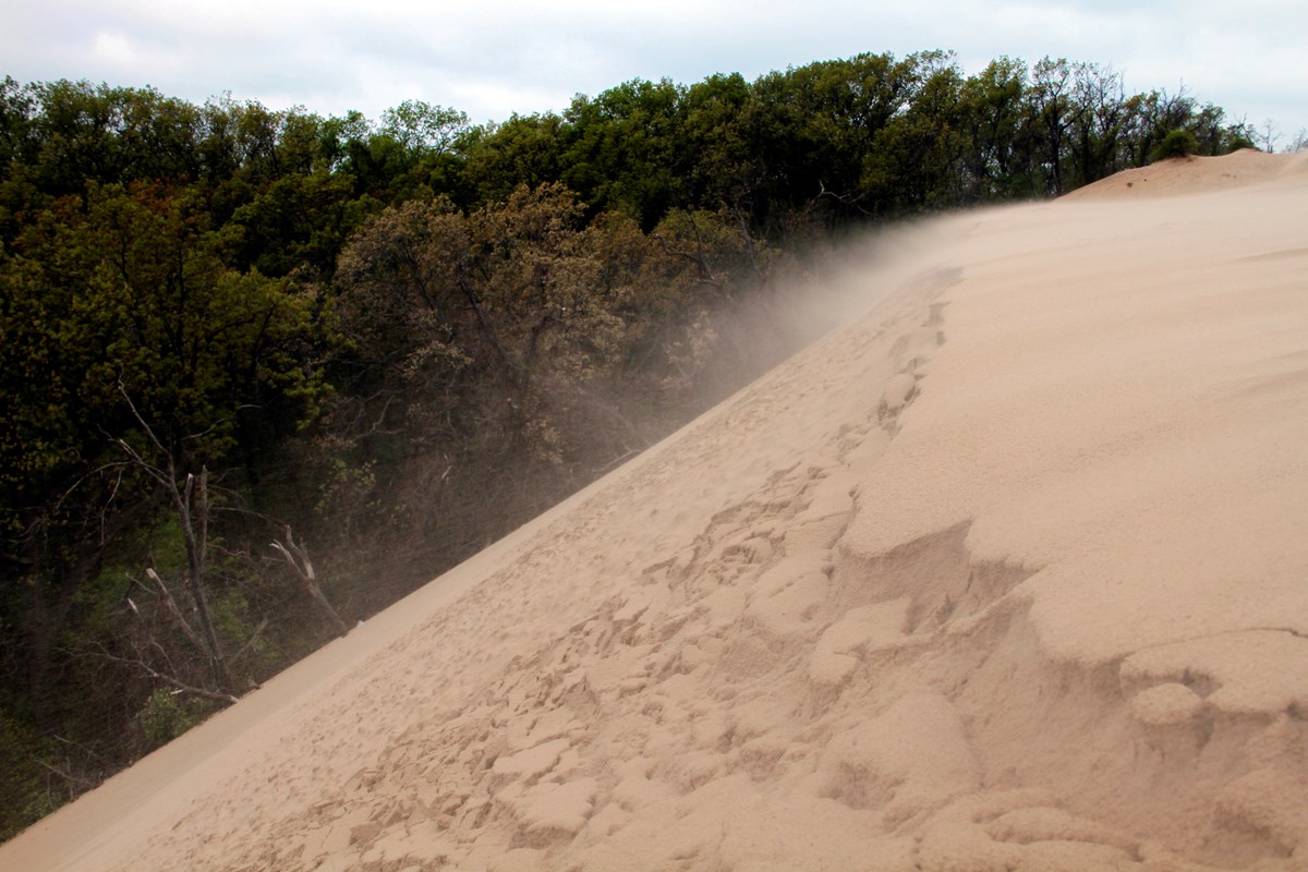 Wind-blown sand drifting across the crest of Mt. Baldy.