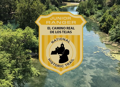 a junior ranger badge over an image of a creek through the woods
